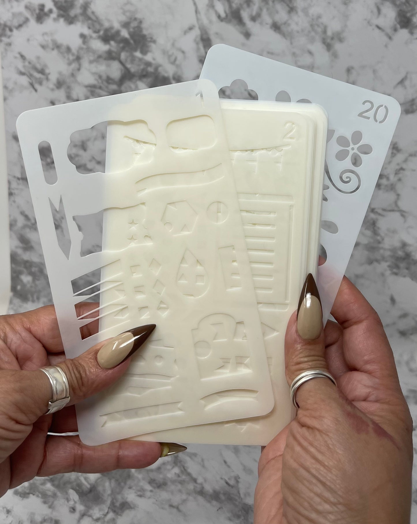 These 20 reusable plastic stencils are perfect for adding unique designs and shapes to your journal! With various designs on each, it's easier than ever to get creative and customize your journal with your own unique style. Instead of using stickers, you can use colored pens and markers to trace the stencils for a more personal touch. These stencils are made of durable plastic, so you can use them multiple times without having to worry about them wearing out.