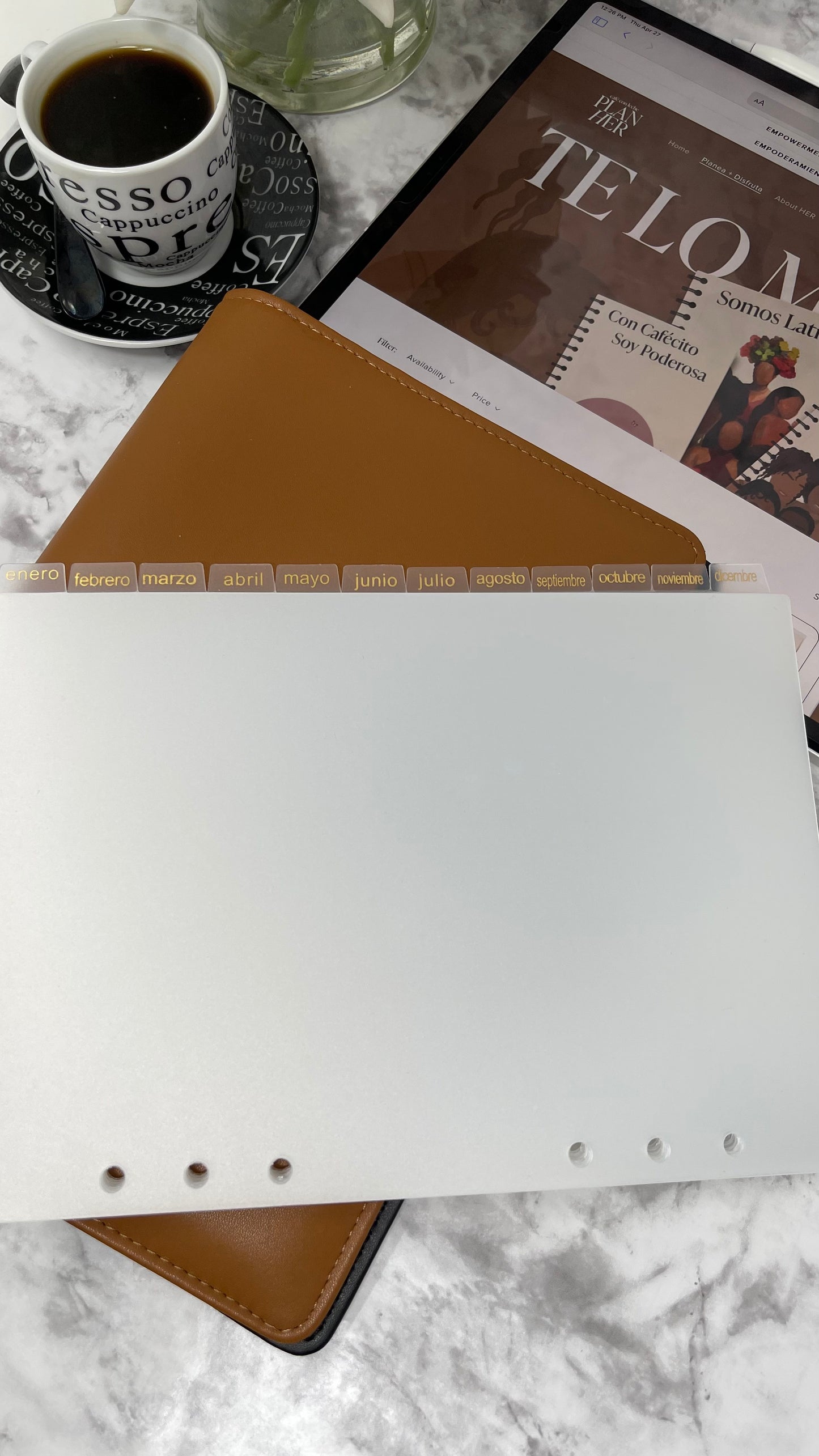 This 12-month divider is perfect for staying organized. The months are printed in plastic both gold and Spanish, on clear frosted plastic . The divider is perfect for filing and organizing documents, and can be easily placed in any A5 binder or folder. The clear frosted plastic adds a subtle, stylish look while ensuring the divider won't take away from the look of your documents.